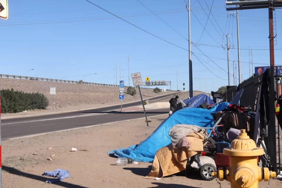 Tents belonging to unhoused people near freeway onramp in Phoenix, Arizona